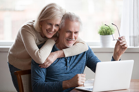 Older couple looking at laptop